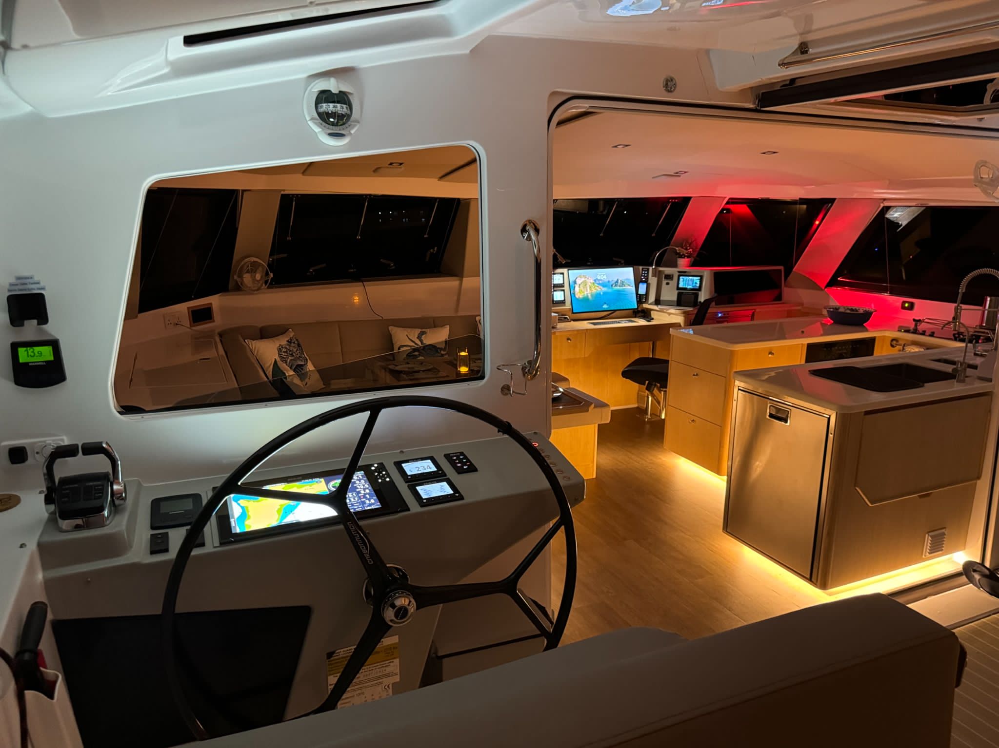 Protected helm and illuminated interior of Seawind 1370 Odyssea